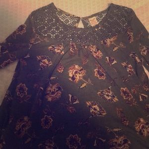 Green faded glory shirt with flowers as pattern